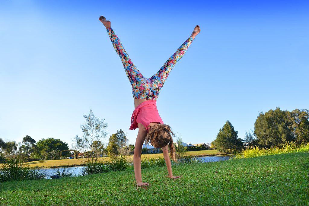 11 year old Anna does a cartwheel 11 year old Anna does a cartwheel