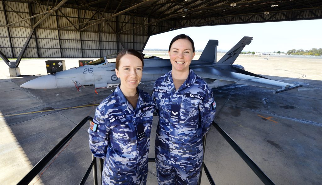 HIGH FLYERS: Dominique Hoffman and Jenna Kowald model the new RAAF uniforms at RAAF Base Amberley on Tuesday. HIGH FLYERS: Dominique Hoffman and Jenna Kowald model the new RAAF uniforms at RAAF Base Amberley on Tuesday.
