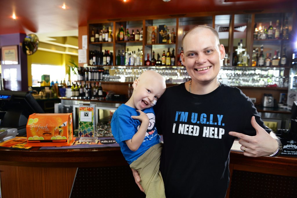 FIGHTING TOGETHER: Yamanto Tavern barman Glen Bauer, with son Ethan, is taking part in the UGLY Bartender campaign. Glen's son Ethan has the disease. FIGHTING TOGETHER: Yamanto Tavern barman Glen Bauer, with son Ethan, is taking part in the UGLY Bartender campaign. Glen's son Ethan has the disease.