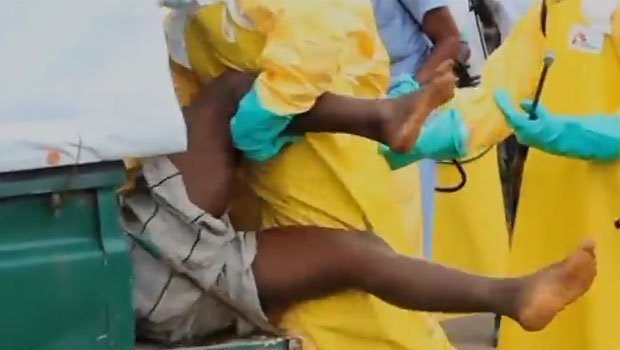 The man was eventually bundled into a truck by medical staff. The man was eventually bundled into a truck by medical staff.