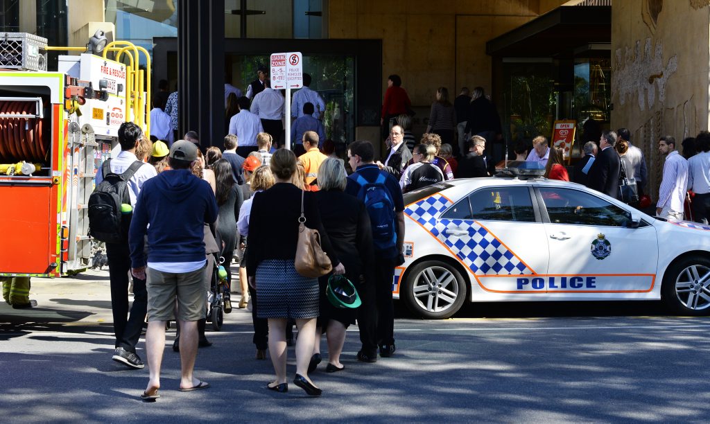People make their way back into the Ipswich Courthouse after it was evacuated on Wednesday morning. People make their way back into the Ipswich Courthouse after it was evacuated on Wednesday morning.