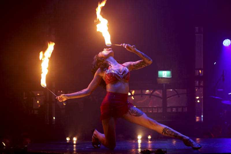A woman breaths fire as she performs on stage during the Limbo circus-cabaret show during Sydney Festival in Sydney, Australia, Wednesday, Jan. 22, 2014. Limbo is an aerial acrobatics show filled with stunts and staggering illusions set to a thrilling live score of brass, electronics, hip-hop and club beats. S A woman breaths fire as she performs on stage during the Limbo circus-cabaret show during Sydney Festival in Sydney, Australia, Wednesday, Jan. 22, 2014. Limbo is an aerial acrobatics show filled with stunts and staggering illusions set to a thrilling live score of brass, electronics, hip-hop and club beats. S