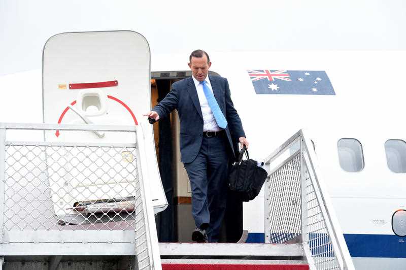 Australian Prime Minister Tony Abbott arrives at Sydney Airport on his first anniversary as PM and on Fathers Day in Sydney, Sunday, Sept. 7, 2014. Australian Prime Minister Tony Abbott arrives at Sydney Airport on his first anniversary as PM and on Fathers Day in Sydney, Sunday, Sept. 7, 2014.
