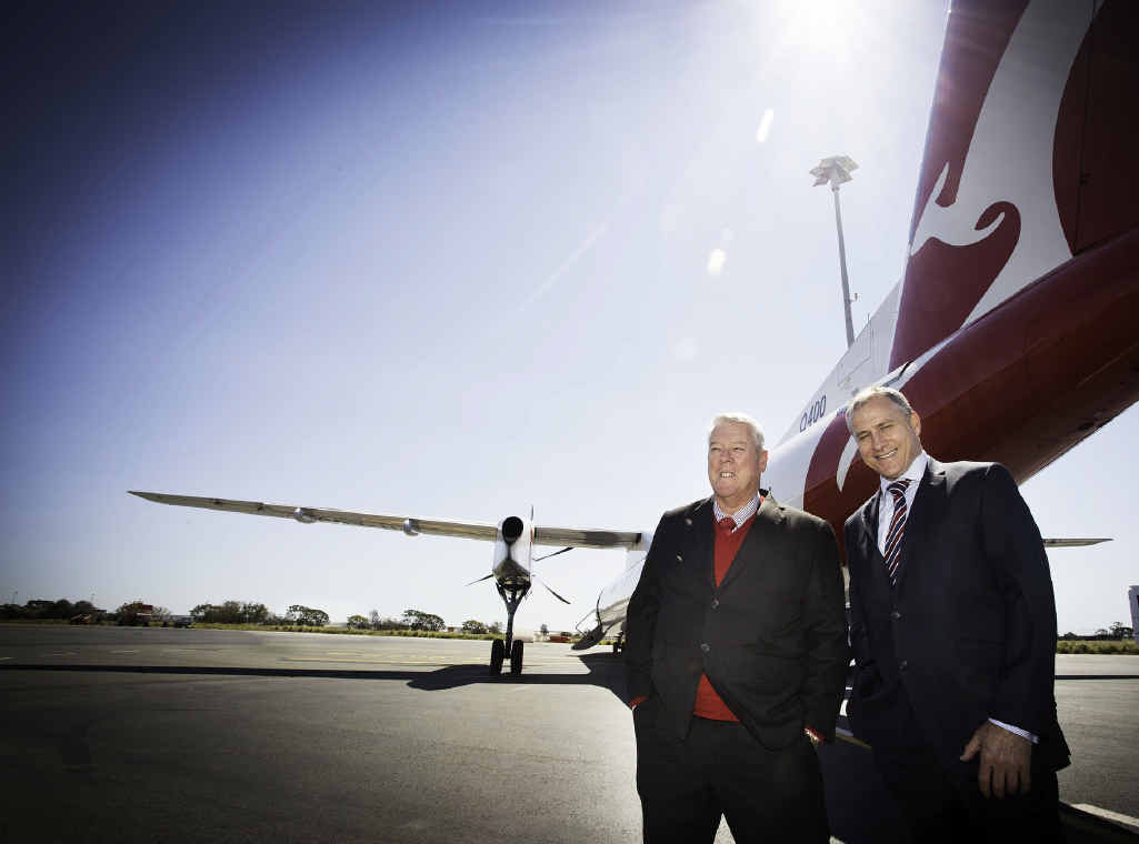 BATTLE BEGINS: Wagners chairman John Wagner and QantasLink chief executive officer John Gissing in front of a Qantas Q400 aircraft that will service Wellcamp airport. BATTLE BEGINS: Wagners chairman John Wagner and QantasLink chief executive officer John Gissing in front of a Qantas Q400 aircraft that will service Wellcamp airport.