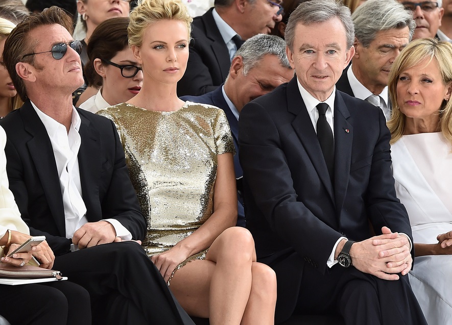 Actors Sean Penn (left) and Charlize Theron joined Bernard Arnault and wife Helene at this year’s Paris Fashion Week Actors Sean Penn (left) and Charlize Theron joined Bernard Arnault and wife Helene at this year’s Paris Fashion Week