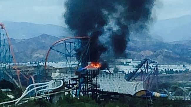 Old Colossus Roller Coaster at Magic Mountain has been damaged by fire. Pic: Twitter/@RonLPitt. Old Colossus Roller Coaster at Magic Mountain has been damaged by fire. Pic: Twitter/@RonLPitt.