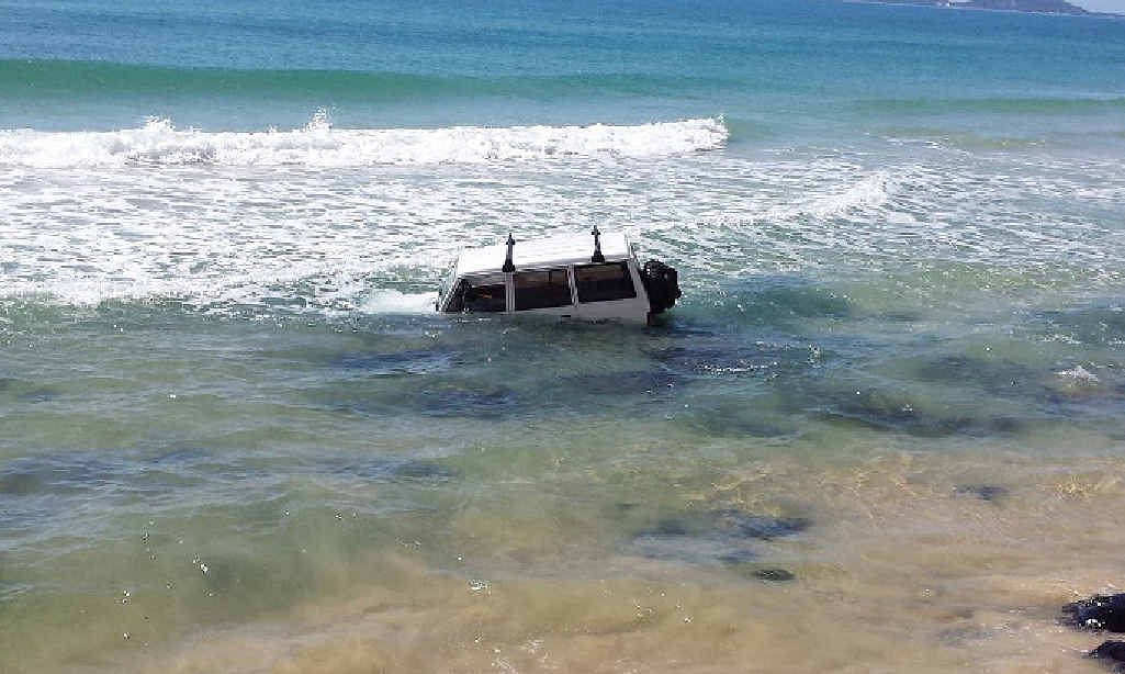 UNDERWATER: This 4WD was a tragic sight for its owner who misjudged the tide. UNDERWATER: This 4WD was a tragic sight for its owner who misjudged the tide.