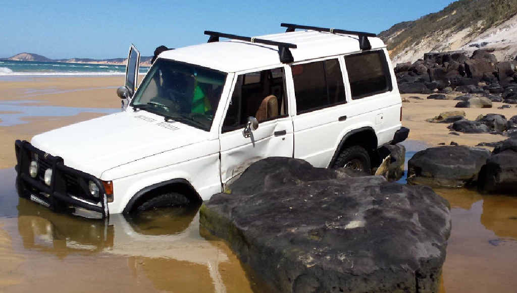 DROWNED: A Mitsubishi Pajero was flooded after it became trapped at Mudlo Rocks on Wednesday night. Crews recovered it Thursday morning. DROWNED: A Mitsubishi Pajero was flooded after it became trapped at Mudlo Rocks on Wednesday night. Crews recovered it Thursday morning.