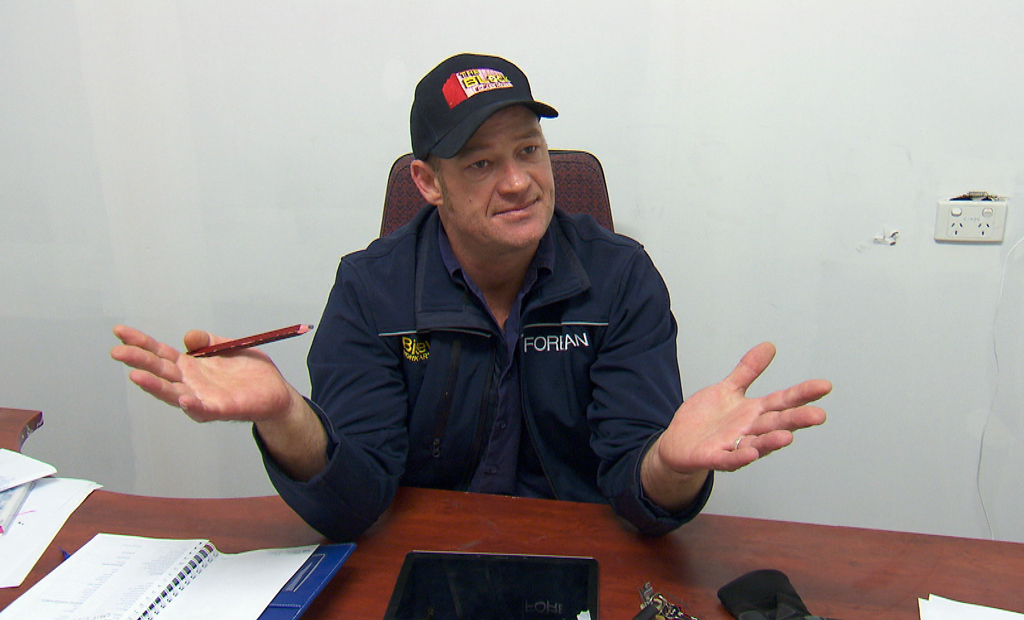 Site foreman Keith Schleiger discusses the problems posed by the underground tank. Site foreman Keith Schleiger discusses the problems posed by the underground tank.
