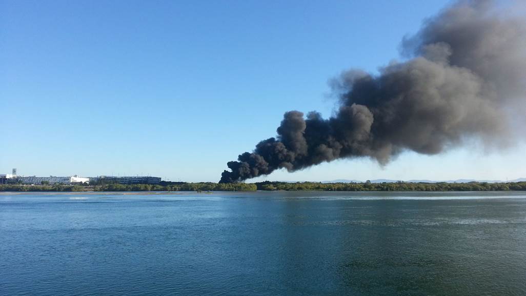 Thick smoke billows from a fire near the Pioneer River in this photo by Mackay Weather Chasers. Thick smoke billows from a fire near the Pioneer River in this photo by Mackay Weather Chasers.