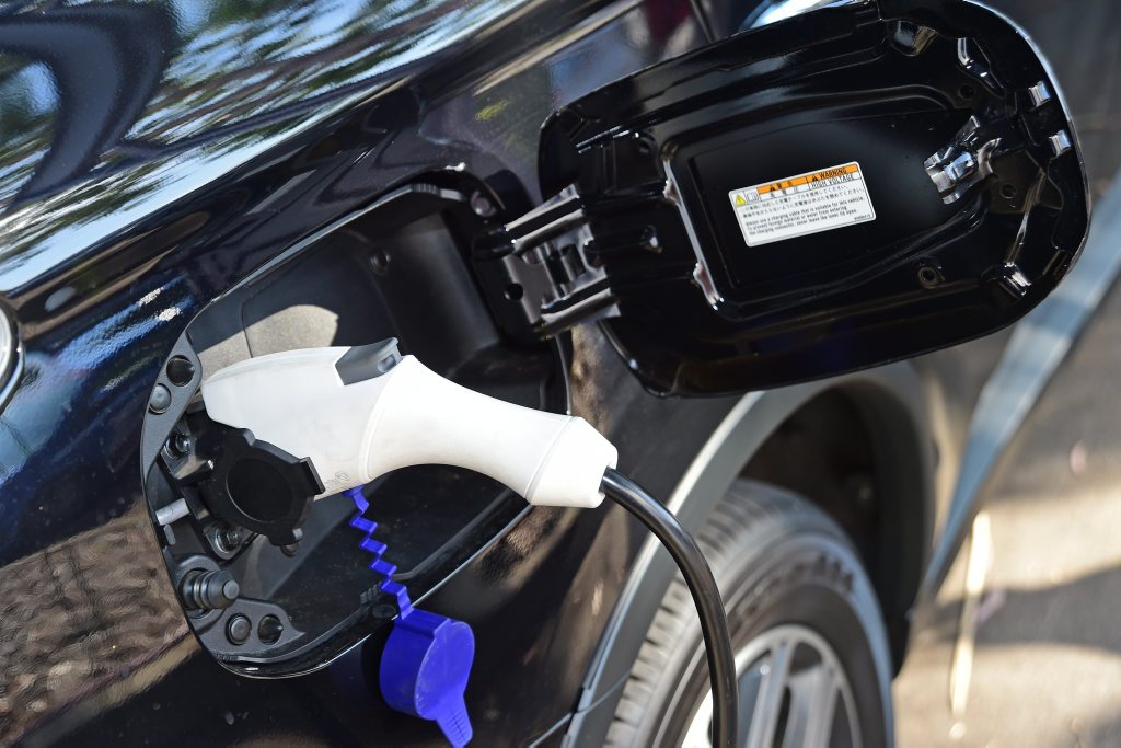CHARGE TIME: Mitsubishi Outlander PHEV getting charged by a plug point. CHARGE TIME: Mitsubishi Outlander PHEV getting charged by a plug point.