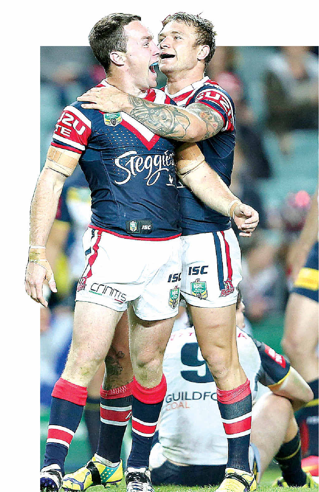CROWING: James Maloney celebrates a try with Jake Friend during Friday night’s clash between the Roosters and the Cowboys. CROWING: James Maloney celebrates a try with Jake Friend during Friday night’s clash between the Roosters and the Cowboys.