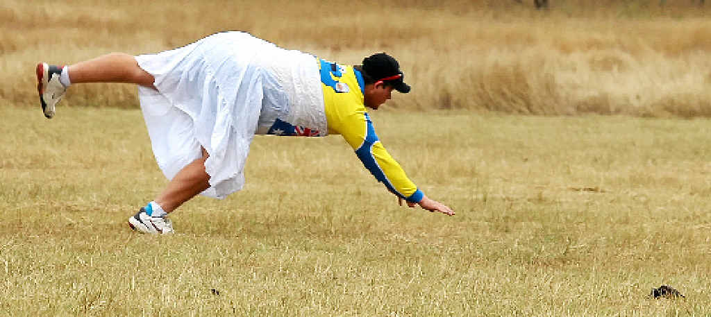 ASHES CLASHES: Action at the Reedybrook Ashes cricket carnival when a player dives in the outer not far from a cow pat. ASHES CLASHES: Action at the Reedybrook Ashes cricket carnival when a player dives in the outer not far from a cow pat.