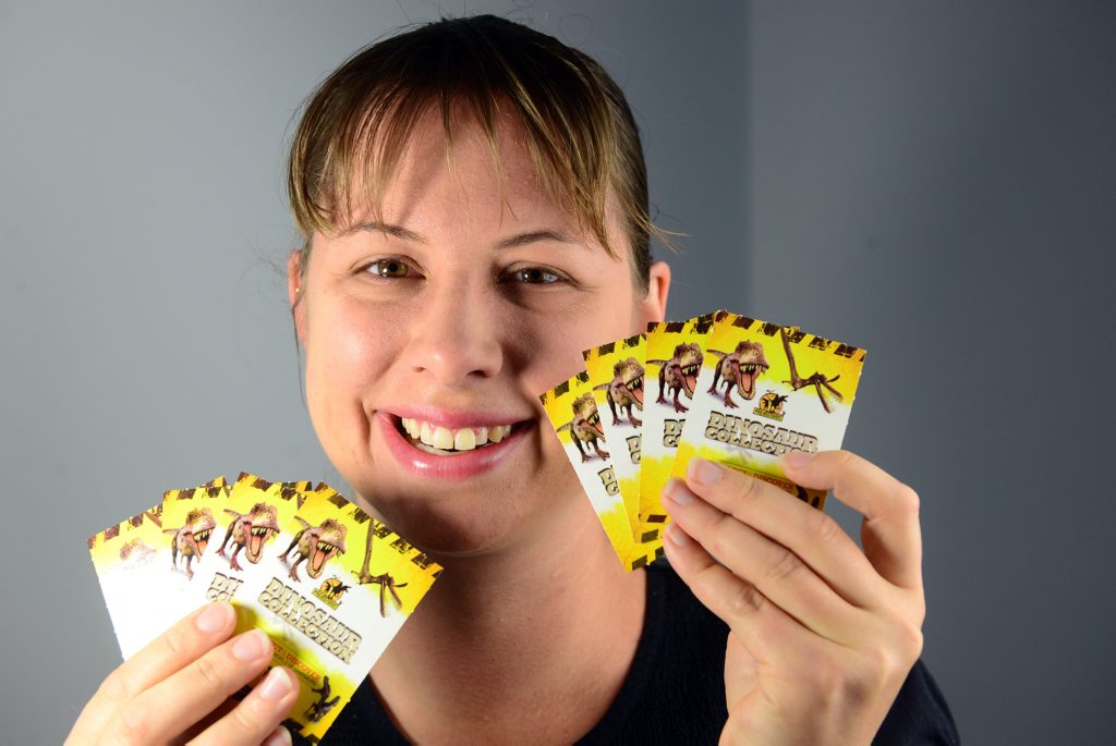 DINO CARDS: Megan Waldock is asking people who might have spare dinosaur collector cards to come forward so they can be shared among children in the region and further afield. Photo: Max Fleet / NewsMail