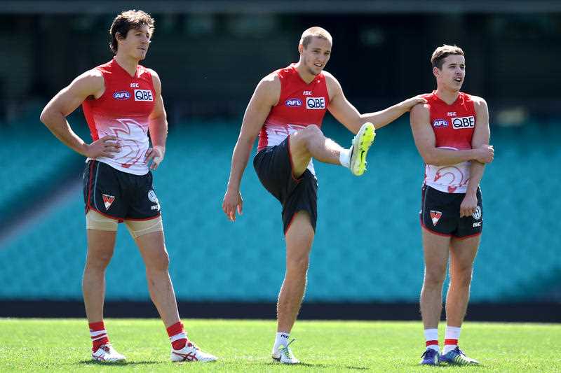 (L to R) Sydney Swans AFL players Kurt Tippett, Sam Reid and Jake Lloyd take part in a training session in Sydney on Wednesday, Sept. 17, 2014. The Swans will play against the North Melbourne Kangaroos in the preliminary final in Sydney on Friday night. (L to R) Sydney Swans AFL players Kurt Tippett, Sam Reid and Jake Lloyd take part in a training session in Sydney on Wednesday, Sept. 17, 2014. The Swans will play against the North Melbourne Kangaroos in the preliminary final in Sydney on Friday night.