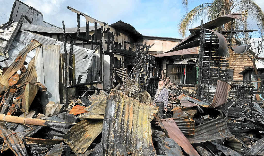 LOST MEMORIES: Michael Balderstone trying to save a few items from the museum after the devastating fire in Cullen street in Nimbin. LOST MEMORIES: Michael Balderstone trying to save a few items from the museum after the devastating fire in Cullen street in Nimbin.