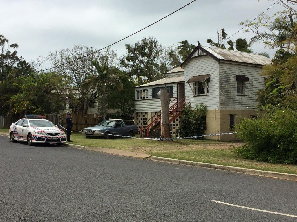 A police officer at the scene of a suspected home invasion in Pialba's Charles St. A police officer at the scene of a suspected home invasion in Pialba's Charles St.