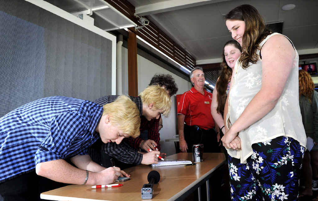 SINGING STARS: Brothers 3 sign autographs for Jemma, 15, and Kayda, 14, Butler, of Lismore at the Cherry Street Sports Club. SINGING STARS: Brothers 3 sign autographs for Jemma, 15, and Kayda, 14, Butler, of Lismore at the Cherry Street Sports Club.