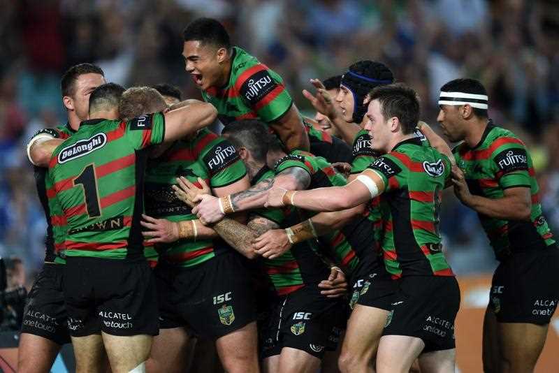 Rabbitohs' players celebrate a try from George Burgess during the 2014 NRL Grand Final match between the South Sydney Rabbitohs and the Canterbury-Bankstown Bulldogs at ANZ Stadium in Sydney, Sunday, Oct. 5, 2014. Rabbitohs' players celebrate a try from George Burgess during the 2014 NRL Grand Final match between the South Sydney Rabbitohs and the Canterbury-Bankstown Bulldogs at ANZ Stadium in Sydney, Sunday, Oct. 5, 2014.