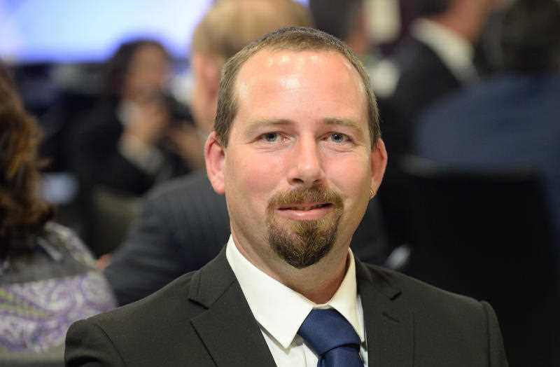 The Australian Motoring Enthusiast Party's Ricky Muir listens on as Palmer United Party leader Clive Palmer addresses the National Press Club in Canberra, Tuesday, Nov. 12, 2013. The Australian Motoring Enthusiast Party's Ricky Muir listens on as Palmer United Party leader Clive Palmer addresses the National Press Club in Canberra, Tuesday, Nov. 12, 2013.