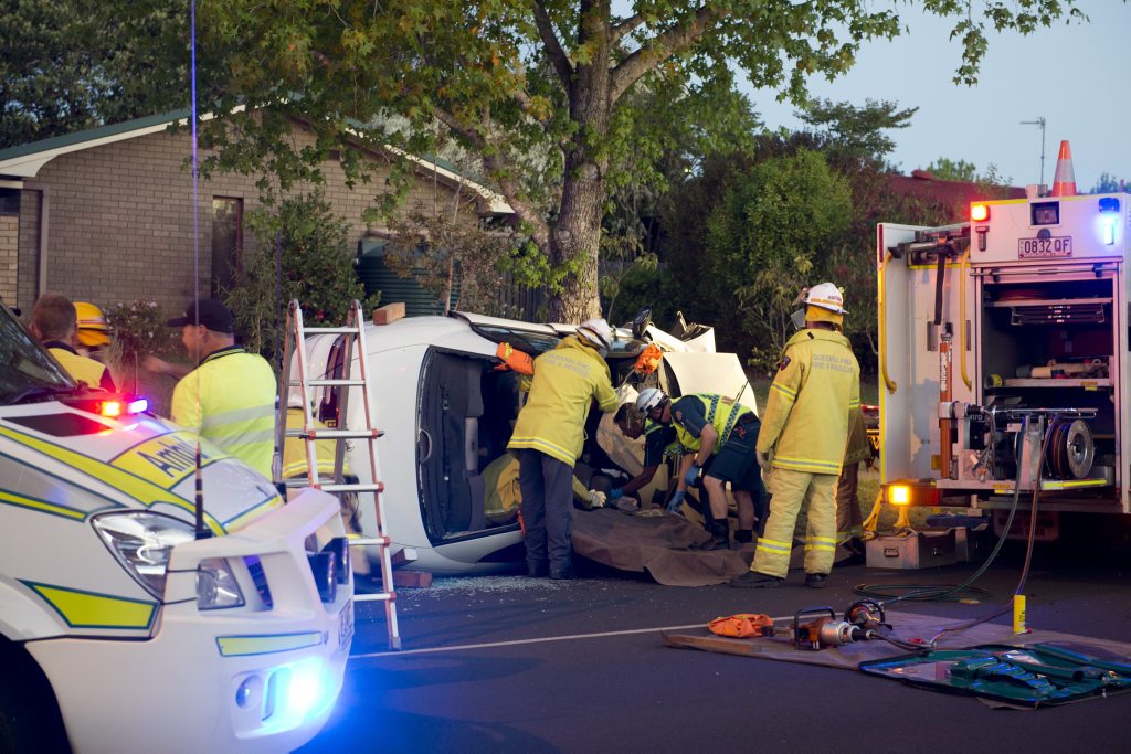 Emergency services work to free a female trapped in a single vehicle crash at the intersection of Hume St and Hibiscus Dr, Kearneys Spring. Emergency services work to free a female trapped in a single vehicle crash at the intersection of Hume St and Hibiscus Dr, Kearneys Spring.