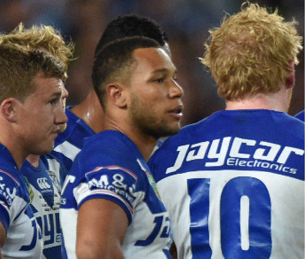 HUGE EFFORT: Moses Mbye with his dejected Bulldogs’ teammates after a late avalanche of points made final scoreline 30-6. HUGE EFFORT: Moses Mbye with his dejected Bulldogs’ teammates after a late avalanche of points made final scoreline 30-6.