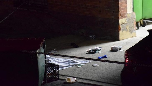 A man's body covered with a blanket at a home in Dath St, in Brisbane suburb of Teneriffe. A man's body covered with a blanket at a home in Dath St, in Brisbane suburb of Teneriffe.