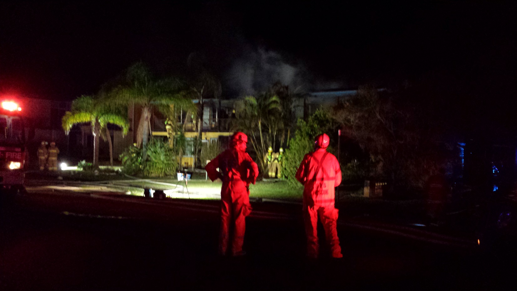 Firefighters outside the unit block at Owen Street. Firefighters outside the unit block at Owen Street.