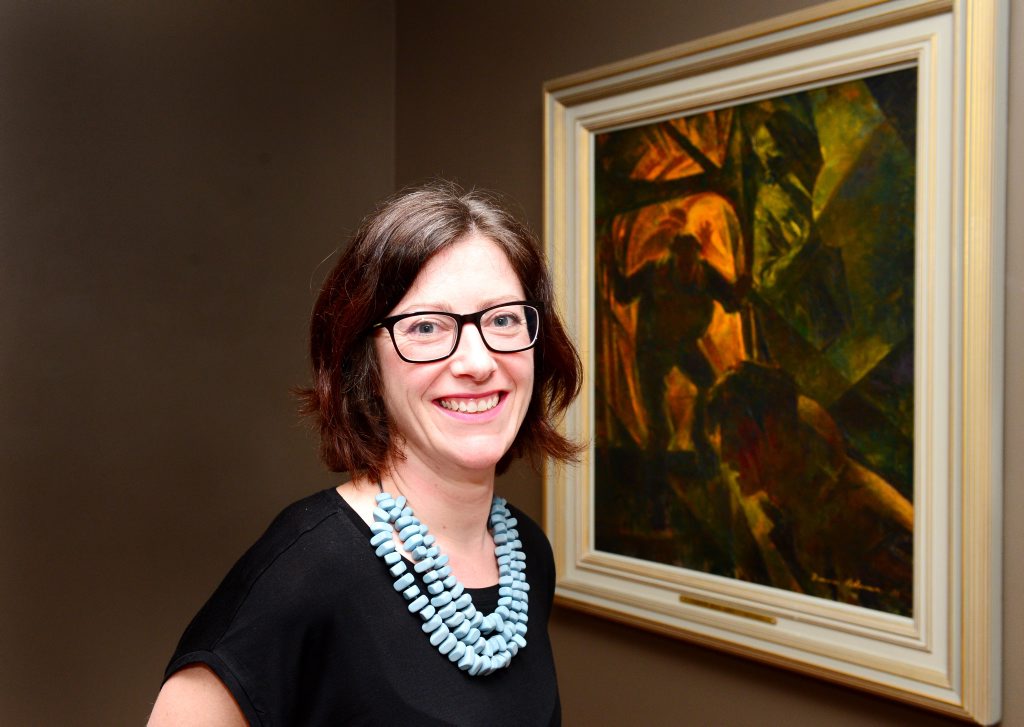 Bridie Macgillicuddy, Assistant Curator of Art, Australian War Memorial in Rockhampton assisting with the exhibition installation. Photo Sharyn O'Neill / The Morning Bulletin Bridie Macgillicuddy, Assistant Curator of Art, Australian War Memorial in Rockhampton assisting with the exhibition installation. Photo Sharyn O'Neill / The Morning Bulletin