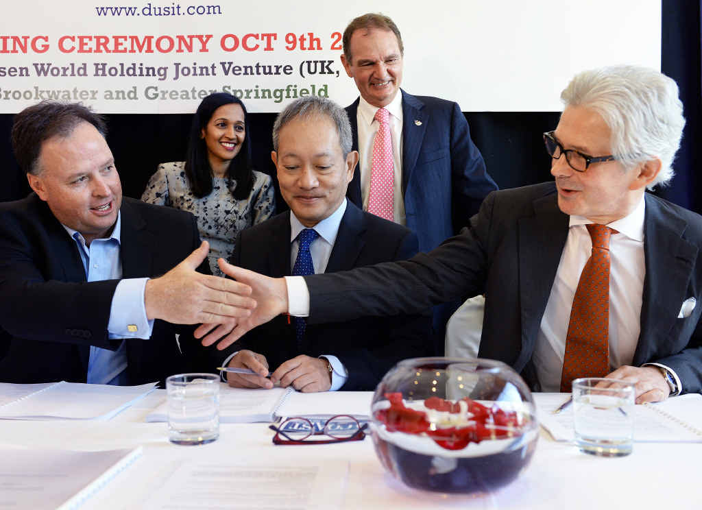 FUTURE PLANS: Brookwater Resort Investments CEO Richard Turner (left) shakes hands with Dusit Thani CEO David Shackleton while Maxsen Capital Hong Kong CEO Jimmy Chan (middle) looks on. FUTURE PLANS: Brookwater Resort Investments CEO Richard Turner (left) shakes hands with Dusit Thani CEO David Shackleton while Maxsen Capital Hong Kong CEO Jimmy Chan (middle) looks on.