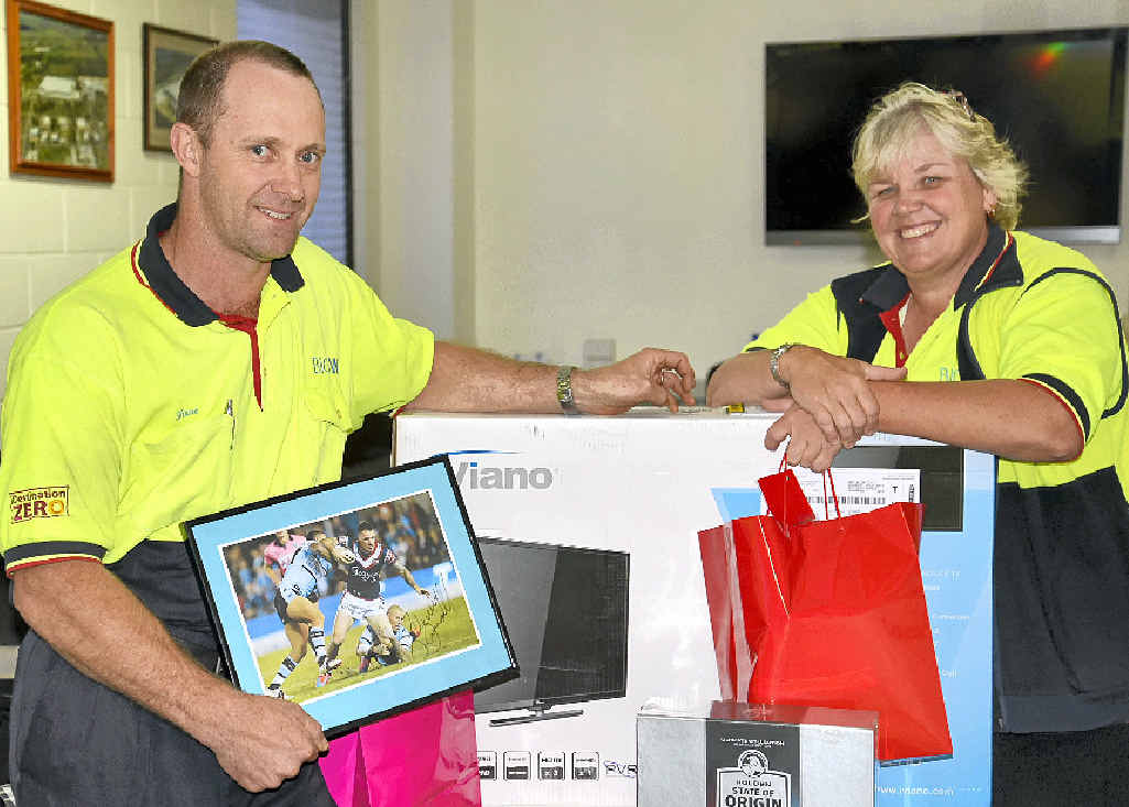 Big W Distribution Centre inventory manager Shane Kerr and shift manager Molly Seibel with some of the prizes for the charity golf day on Saturday. Big W Distribution Centre inventory manager Shane Kerr and shift manager Molly Seibel with some of the prizes for the charity golf day on Saturday.