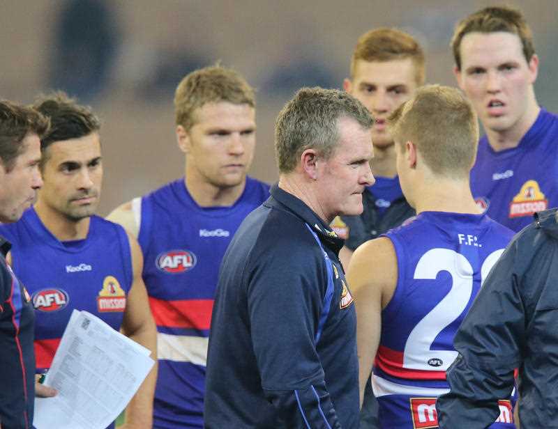 Bulldogs coach Brendan McCarthy talks to his players in the break during the Round 14 AFL match between the Melbourne Demons and the Western Bulldogs at the MCG in Melbourne, Saturday, June 29, 2013. Bulldogs coach Brendan McCarthy talks to his players in the break during the Round 14 AFL match between the Melbourne Demons and the Western Bulldogs at the MCG in Melbourne, Saturday, June 29, 2013.