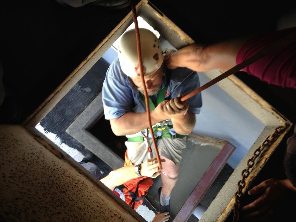 Neil Allport being lowered through the access ports at the top of the Gladstone Metro Hotel. Neil Allport being lowered through the access ports at the top of the Gladstone Metro Hotel.