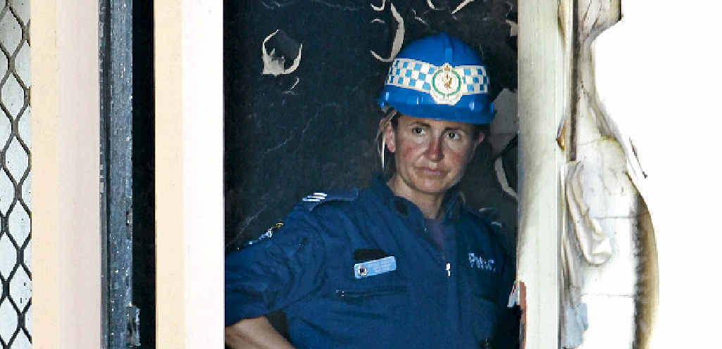AFTERMATH: Police investigating the burnt shell of the house at 10 Margaret Cr, South Grafton, where Michelle Roberts' body was found. AFTERMATH: Police investigating the burnt shell of the house at 10 Margaret Cr, South Grafton, where Michelle Roberts' body was found.