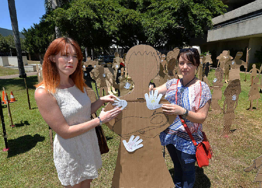 LEFT: Fiona Mullins and Cherrie Hughes offer support by adding to the Stand Against Poverty art installation. LEFT: Fiona Mullins and Cherrie Hughes offer support by adding to the Stand Against Poverty art installation.