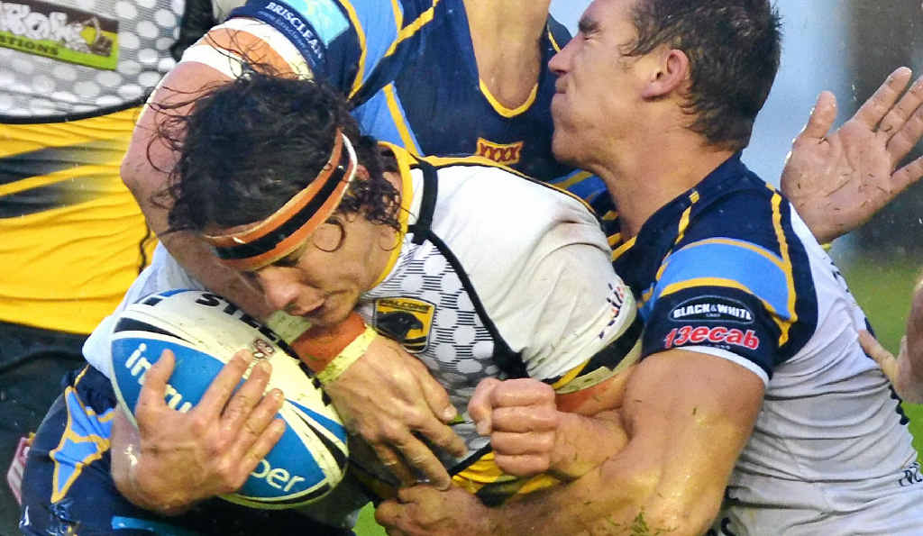 EVENTFUL YEAR: The Falcons’ Tom Murphy gets wrapped up by the Devils’ defence at Sunshine Coast Stadium on August 16. EVENTFUL YEAR: The Falcons’ Tom Murphy gets wrapped up by the Devils’ defence at Sunshine Coast Stadium on August 16.