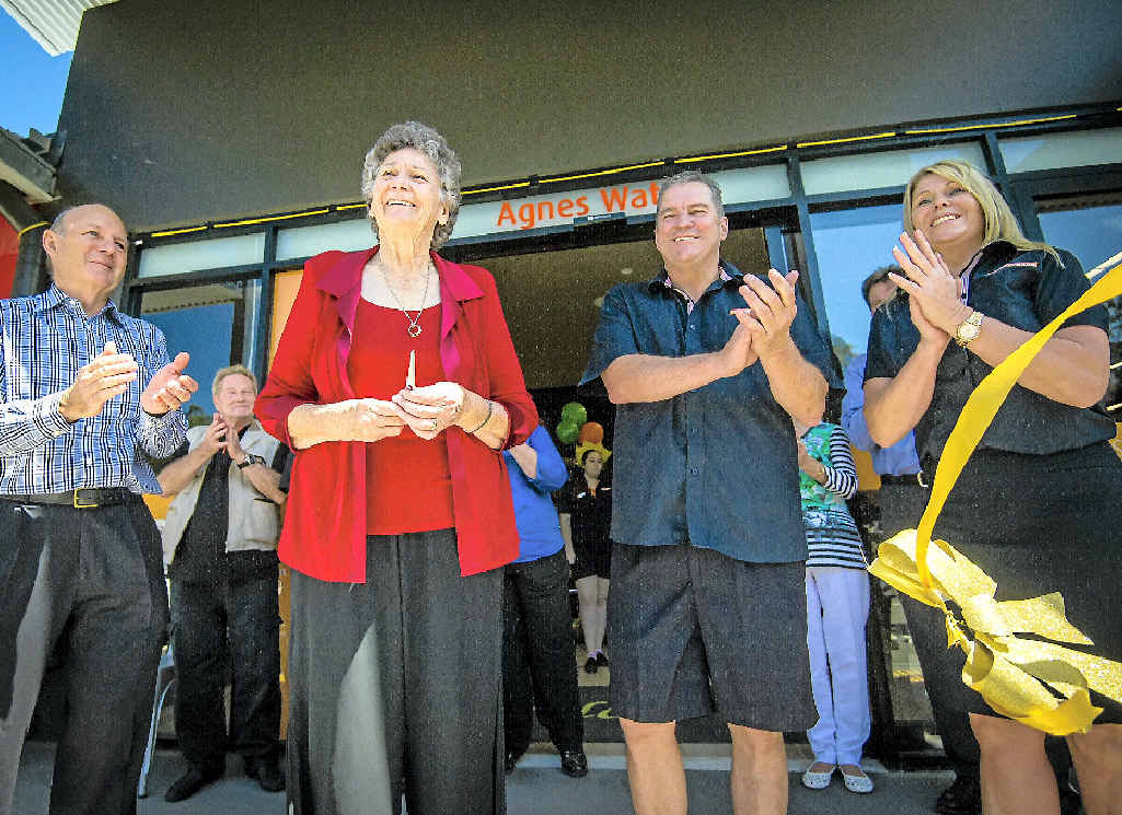 IN BUSINESS: Developer Geoff Bonney, long-time resident Betty Mergard, and Foodworks owners Peter Kinder and Michelle Irvine cut the ribbon. IN BUSINESS: Developer Geoff Bonney, long-time resident Betty Mergard, and Foodworks owners Peter Kinder and Michelle Irvine cut the ribbon.