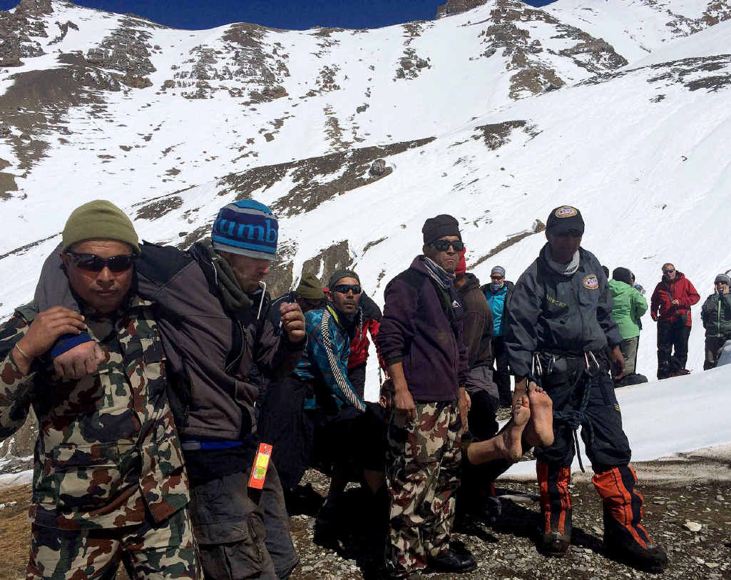 Nepal Army personnel helping survivors to an Army helicopter in the Manang district along the Annapurna Circuit Trek. Nepal Army personnel helping survivors to an Army helicopter in the Manang district along the Annapurna Circuit Trek.