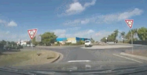 Car drives straight over Mackay roundabout. Car drives straight over Mackay roundabout.