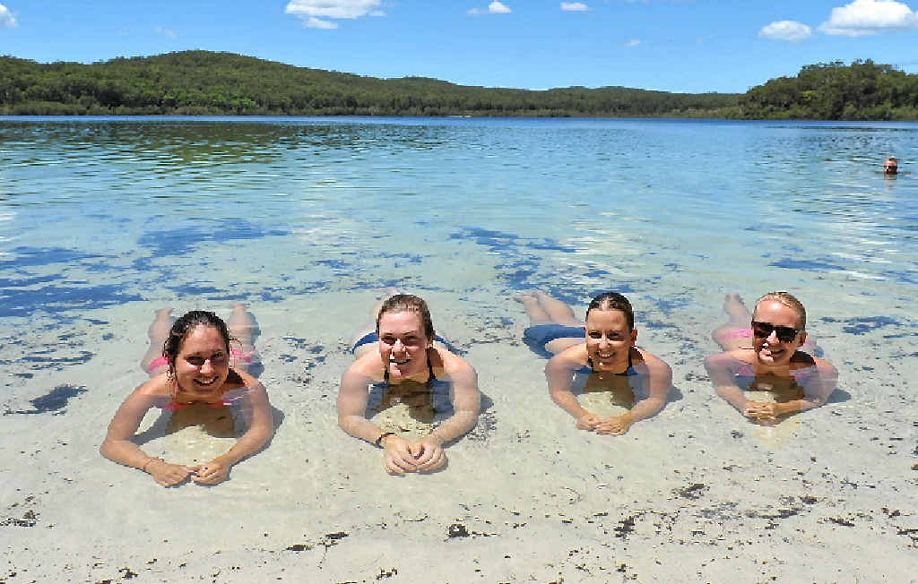 PARADISE: German tourists relax in the pristine waters of Lake McKenzie. PARADISE: German tourists relax in the pristine waters of Lake McKenzie.