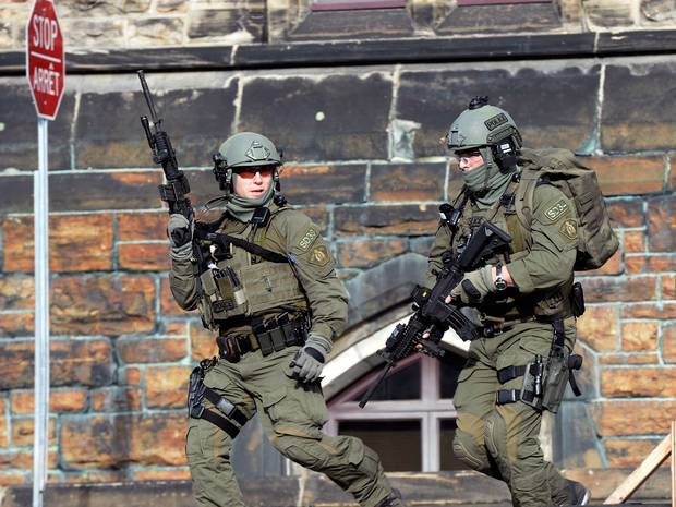 A Royal Canadian Mounted Police intervention team responds to a reported shooting at Parliament building in Ottawa A Royal Canadian Mounted Police intervention team responds to a reported shooting at Parliament building in Ottawa
