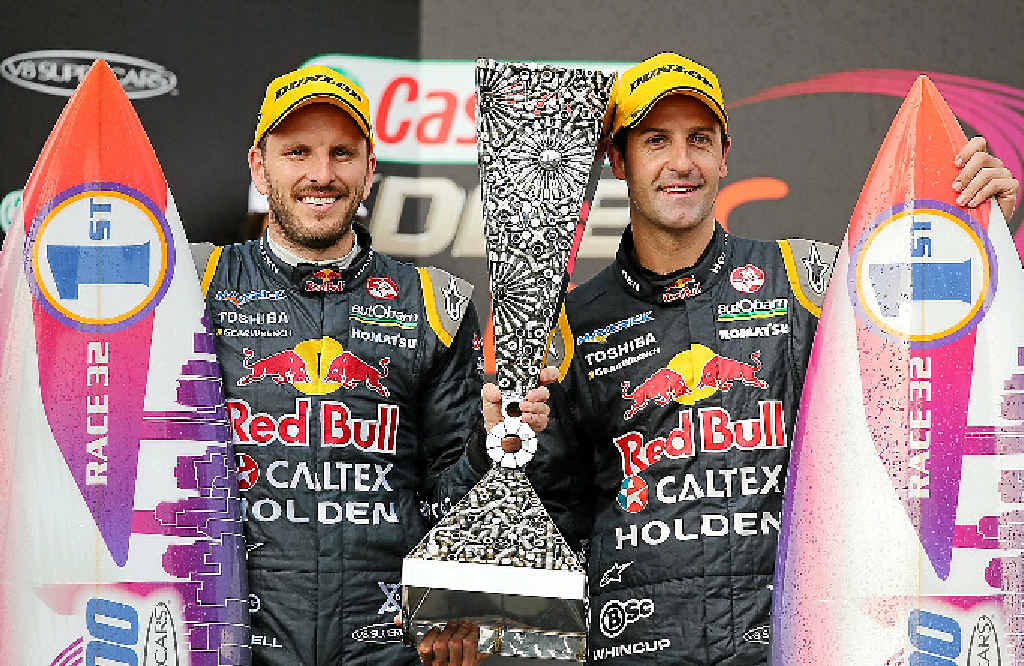 Paul Dumbrell and Jamie Whincup celebrate after winning race 32 at the Gold Coast 600. Paul Dumbrell and Jamie Whincup celebrate after winning race 32 at the Gold Coast 600.
