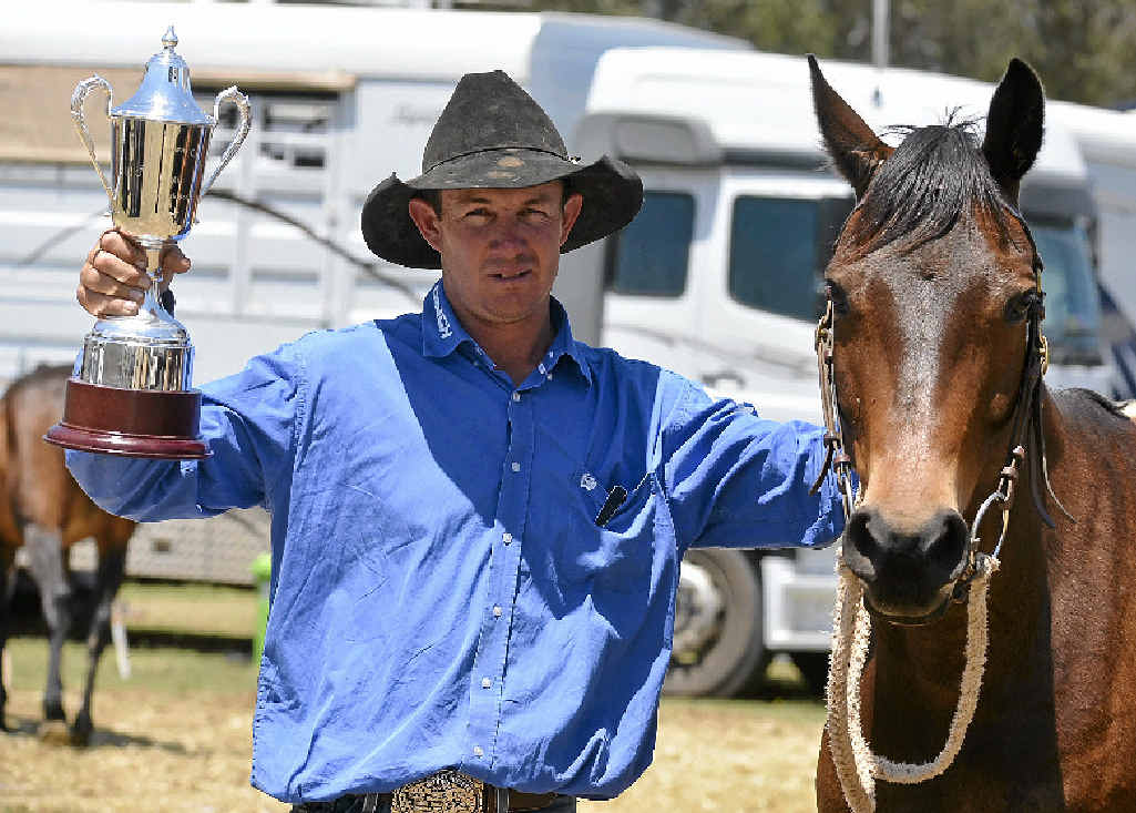 Ben Hall and Eltorrio with the trophy after winning the Supafloats Canning Downs Campdraft at the Warwick Rodeo. Ben Hall and Eltorrio with the trophy after winning the Supafloats Canning Downs Campdraft at the Warwick Rodeo.