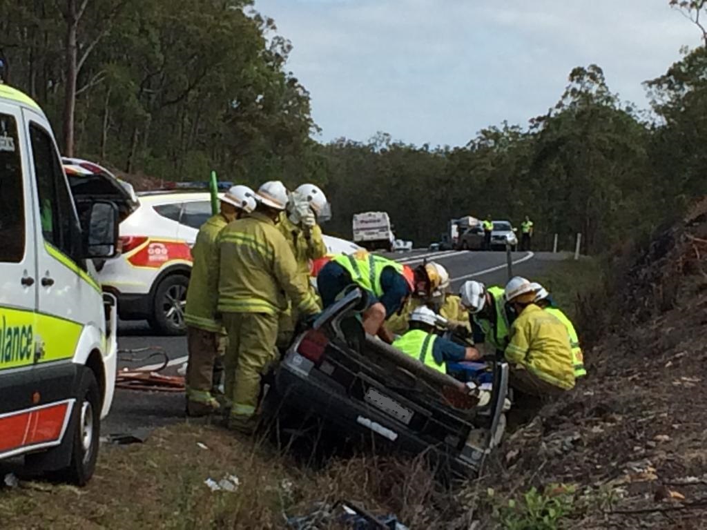 Emergency service personnel work to free a man from a vehicle after a crash on the Bruce Hwy north of Maryborough. Emergency service personnel work to free a man from a vehicle after a crash on the Bruce Hwy north of Maryborough.