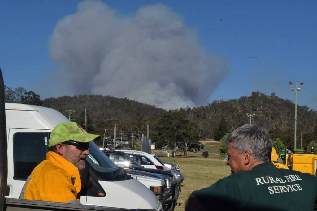 Rural firefighters discuss tactics during a shift changeover at the Ballandean Rural Fire Station on the Southern Downs. Rural firefighters discuss tactics during a shift changeover at the Ballandean Rural Fire Station on the Southern Downs.