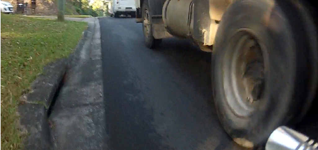 EVIDENCE: A still from the footage of the truck driven by Warwick Fribance passing the cyclist. A split second before the incident a bus passed the rider also. EVIDENCE: A still from the footage of the truck driven by Warwick Fribance passing the cyclist. A split second before the incident a bus passed the rider also.
