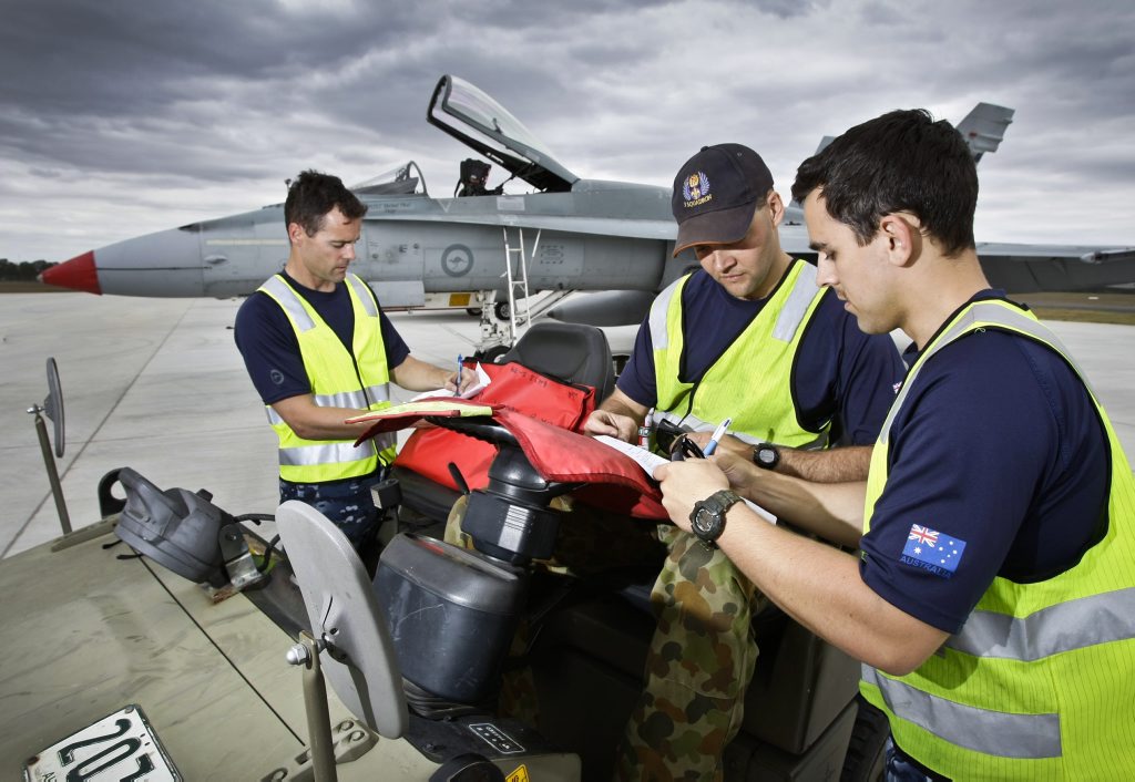 RAAF Aircraft Technicians, (L-R) Leading Aircraftman (LAC) Josh Walsh, LAC Graeme Szynal and LAC Ben Nolte clear maintenance paperwork after the arrival of F/A-18 Hornets at RAAF Base Amberley. The aircraft are on standby to support the G20 Leaders Summit. RAAF Aircraft Technicians, (L-R) Leading Aircraftman (LAC) Josh Walsh, LAC Graeme Szynal and LAC Ben Nolte clear maintenance paperwork after the arrival of F/A-18 Hornets at RAAF Base Amberley. The aircraft are on standby to support the G20 Leaders Summit.