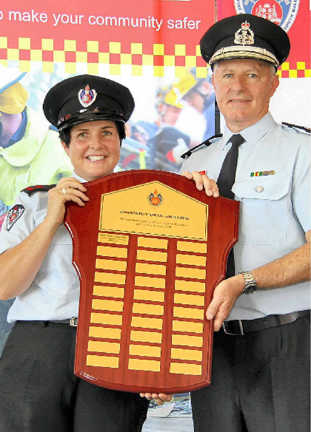 FIRE AWARD: Bangalow Fire Brigade deputy captain Mellissa Madden and FRNSW Commissioner Greg Mullins. FIRE AWARD: Bangalow Fire Brigade deputy captain Mellissa Madden and FRNSW Commissioner Greg Mullins.
