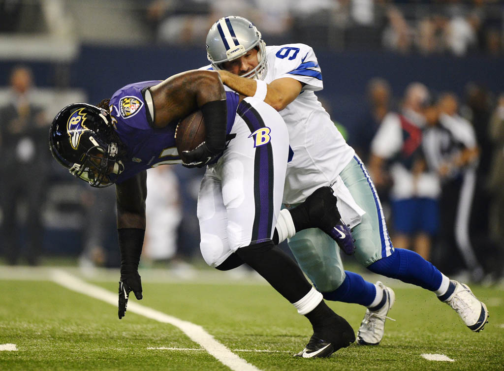Dallas Cowboys quarterback Tony Romo (R) tries to tackle Baltimore Ravens player Courtney Upshaw (L) after a fumble in the first half of their pre-season game at AT&T; Stadium in Arlington, Texas, USA, 16 August 2014. Dallas Cowboys quarterback Tony Romo (R) tries to tackle Baltimore Ravens player Courtney Upshaw (L) after a fumble in the first half of their pre-season game at AT&T; Stadium in Arlington, Texas, USA, 16 August 2014.