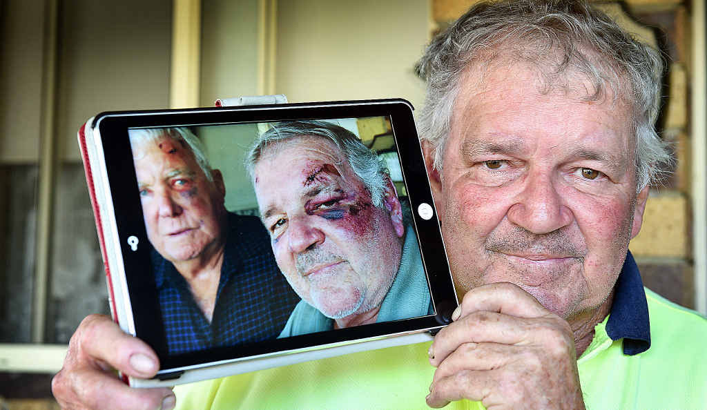 Bashing victim Graham Law with a photo of himself and his brother-in-law Terry White after they were bashed at a Brisbane hotel. Bashing victim Graham Law with a photo of himself and his brother-in-law Terry White after they were bashed at a Brisbane hotel.